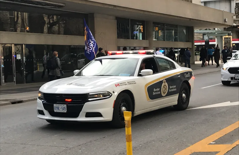 A Canada Border Services Agency patrol car on a city street