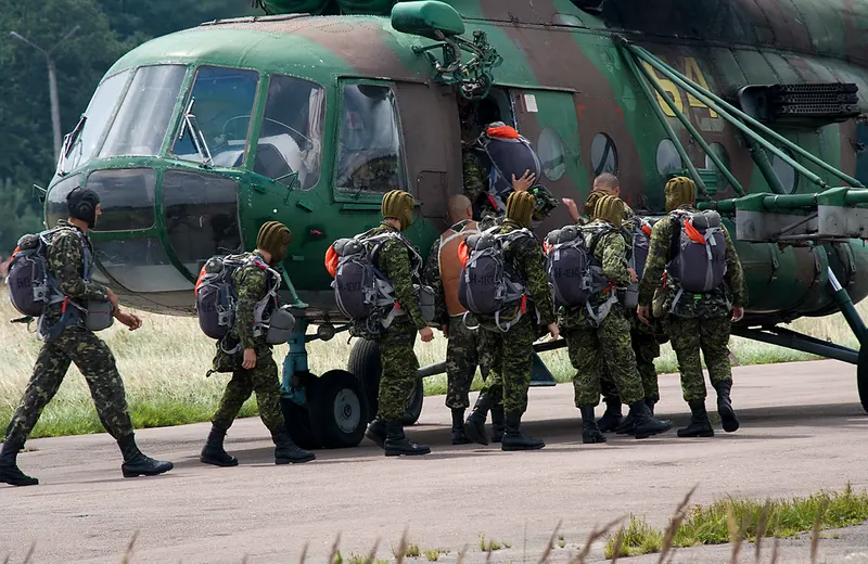 Canadian soldiers boarding a helicopter during a training exercise
